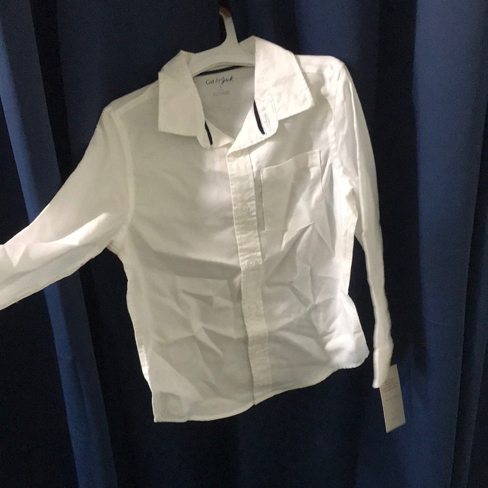 This is a brand new plain white long sleeve shirt.